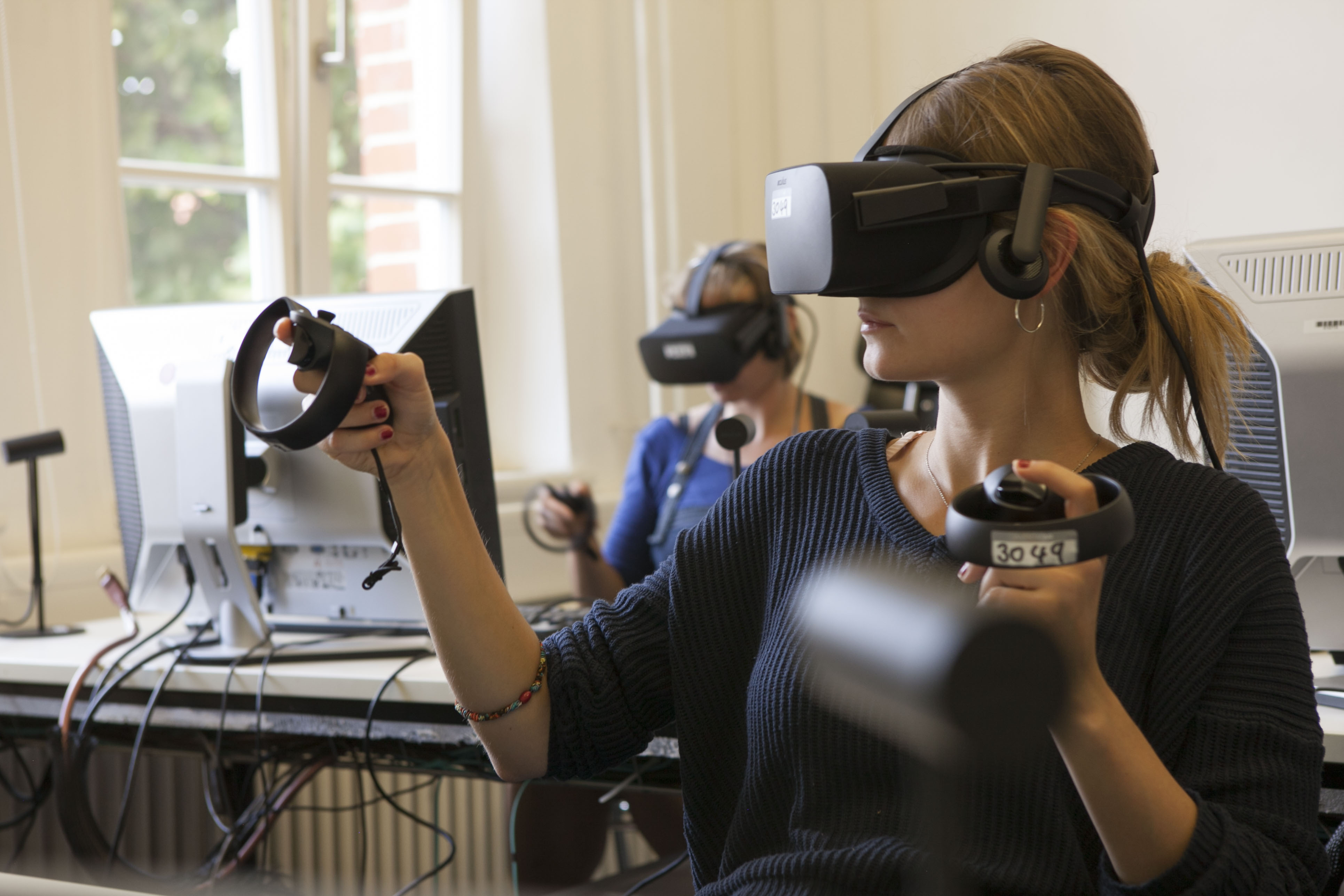 two people in a classroom with vfx devices